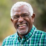 Elderly man smiling at camera